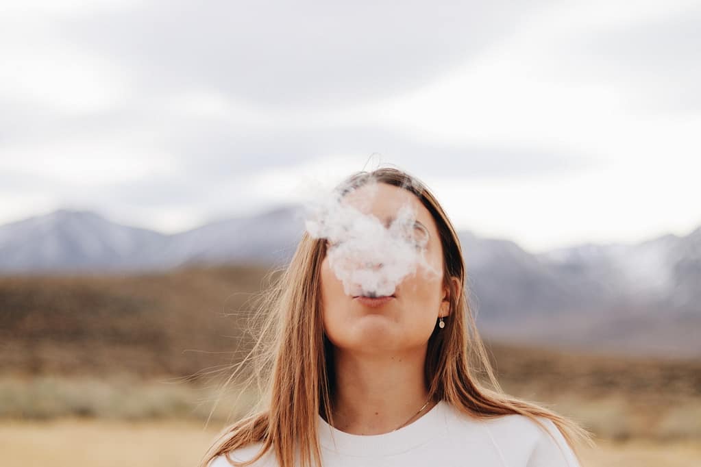 a woman smoking outdoor