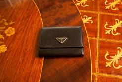 brown-colored prada purse