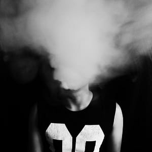 a man and white smoke